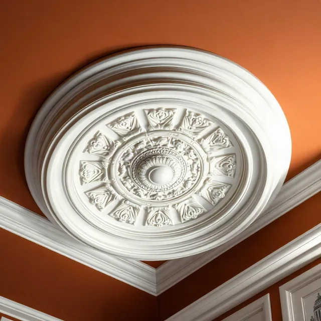 Rosone e cornice in gesso su soffitto